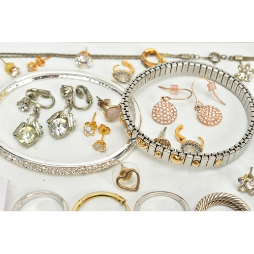 106 - A SELECTION OF JEWELLERY, to include two white metal bangles, a white metal cross pendant set with s... 