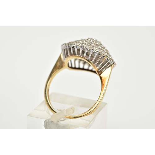 173 - A 9CT GOLD DIAMOND CLUSTER RING, the tiered cluster ring set with single cut diamonds, to the tapere... 