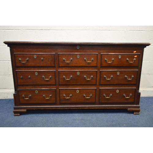 1343 - A GEORGE III OAK AND MAHOGANY CROSSBANDED MULE CHEST, with six dummy drawers above three drawers, br... 