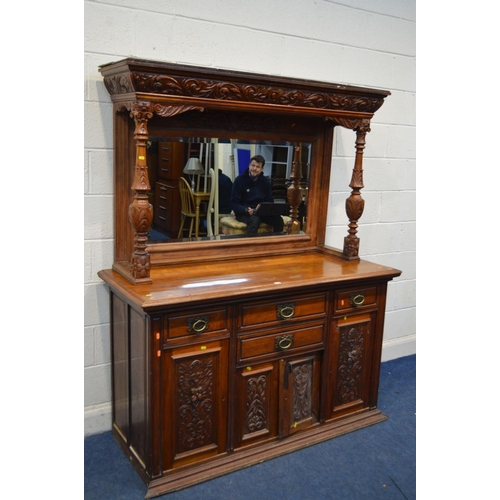 1349 - AN EARLY 20TH CENTURY WALNUT MIRROR BACK SIDEBOARD, foliate decoration, overhanging top supported by... 