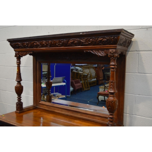 1349 - AN EARLY 20TH CENTURY WALNUT MIRROR BACK SIDEBOARD, foliate decoration, overhanging top supported by... 