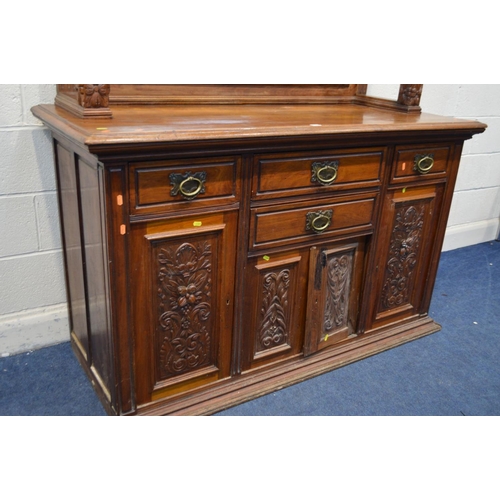 1349 - AN EARLY 20TH CENTURY WALNUT MIRROR BACK SIDEBOARD, foliate decoration, overhanging top supported by... 