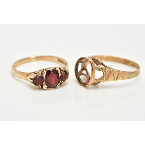 16 - TWO 9CT GOLD RINGS, the first a graduated three stone oval cut garnet ring, within a scroll detailed... 