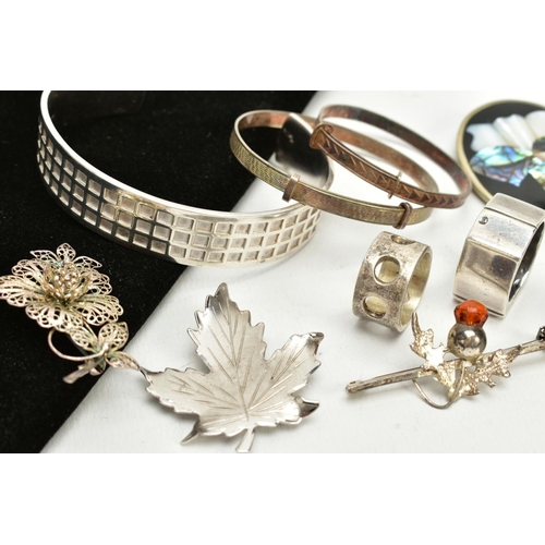 20 - A SELECTION OF WHITE METAL ITEMS, to include a bangle with square detailing all round stamped 925, t... 