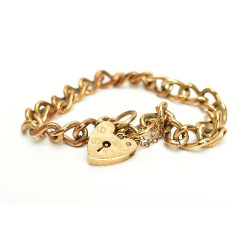 25 - A 9CT GOLD HEAVY CHARM BRACELET, of curb link design hallmarked 9ct gold London import, fitted with ... 