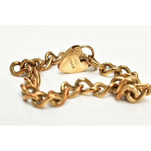 25 - A 9CT GOLD HEAVY CHARM BRACELET, of curb link design hallmarked 9ct gold London import, fitted with ... 