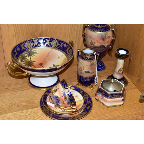 503 - A GROUP OF NORITAKE 'DESERT' SCENED ITEMS, two twin handled vases, height 14cm and pedestal vase, he... 