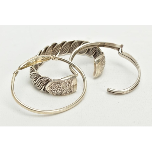 55 - A SILVER CUFF AND TWO WHITE METAL BANGLES, a twist designed cuff hallmarked Birmingham, approximate ... 