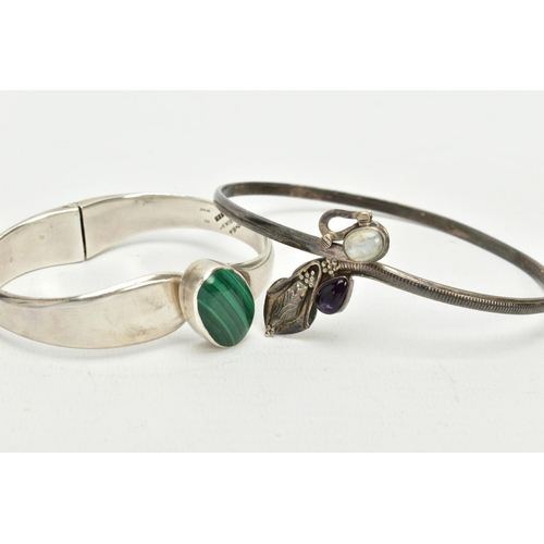 56 - A SILVER MALACHITE SET BANGLE AND A WHITE METAL ARM CUFF, the hinged bangle set with an oval malachi... 