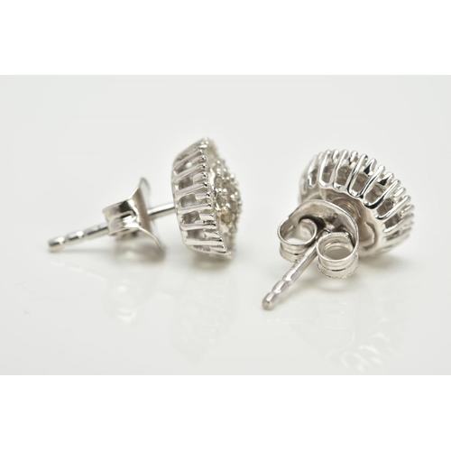 61 - A PAIR OF WHITE METAL CLUSTER EARRINGS, each of a circular form, set with single cut diamond detaile... 