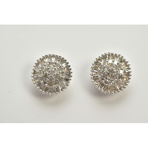 61 - A PAIR OF WHITE METAL CLUSTER EARRINGS, each of a circular form, set with single cut diamond detaile... 