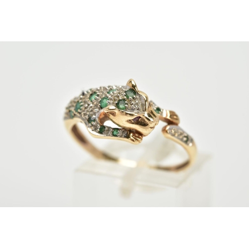 69 - A 9CT GOLD, EMERALD AND DIAMOND PANTHER RING, in the form of a leaping panther set with a circular c... 