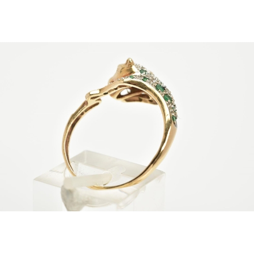 69 - A 9CT GOLD, EMERALD AND DIAMOND PANTHER RING, in the form of a leaping panther set with a circular c... 