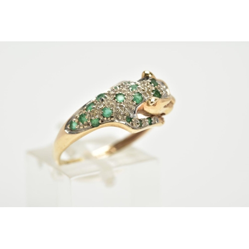 69 - A 9CT GOLD, EMERALD AND DIAMOND PANTHER RING, in the form of a leaping panther set with a circular c... 