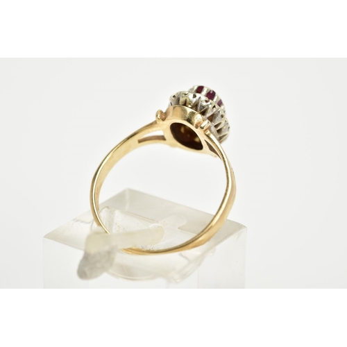 41 - A 9CT GOLD RUBY AND DIAMOND CLUSTER RING, the raised cluster designed with a claw set oval cut ruby,... 