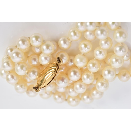 14 - A GRADUATED CULTURED PEARL NECKLACE, fitted to a yellow metal oval fish hook clasp, stamped 375, len... 