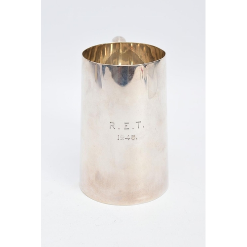 16 - A SILVER TANKARD, of a plain polished design, engraved 'R.E.T 1945', hallmarked Sheffield 1944 'Walk... 