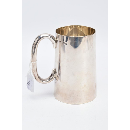 16 - A SILVER TANKARD, of a plain polished design, engraved 'R.E.T 1945', hallmarked Sheffield 1944 'Walk... 