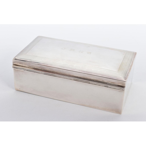 17 - A SILVER LINED CIGARETTE BOX, of a plain polished design, engraved to the lid 'B.N.W.C.' within an e... 