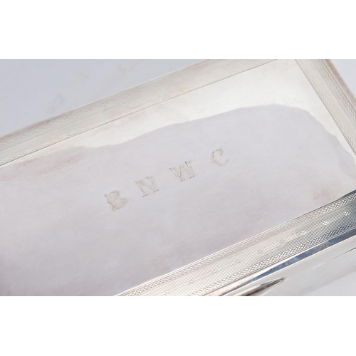 17 - A SILVER LINED CIGARETTE BOX, of a plain polished design, engraved to the lid 'B.N.W.C.' within an e... 