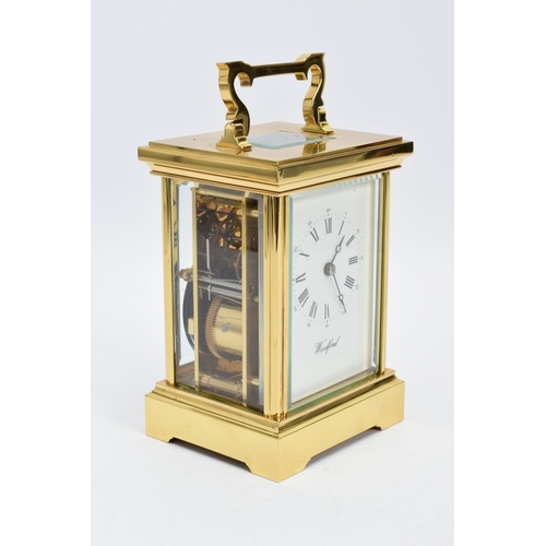 20 - A WOODFORD ENGLISH BRASS STRIKING CARRIAGE CLOCK, white dial with Brequet style hands, Roman numeral... 