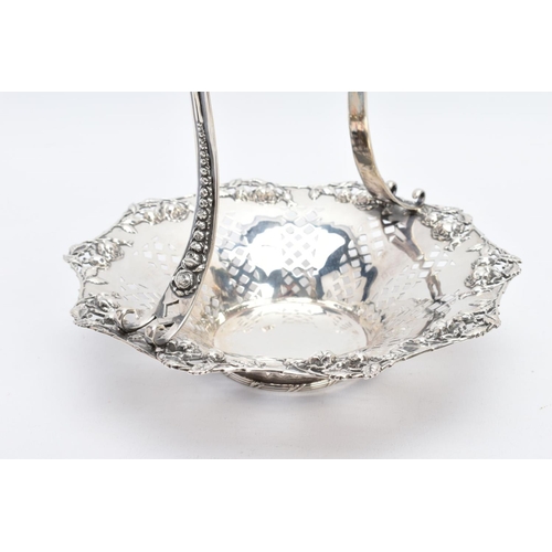 24 - A TIFFANY & CO STERLING SILVER BASKET, with an openwork rose and rose bud detailed surround and elon... 