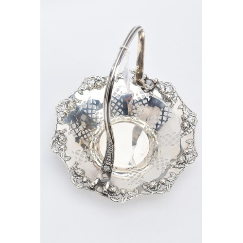 24 - A TIFFANY & CO STERLING SILVER BASKET, with an openwork rose and rose bud detailed surround and elon... 