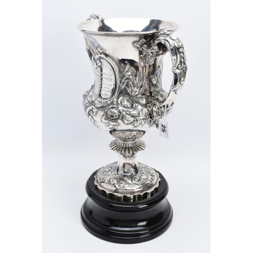 25 - A SILVER TROPHY CUP WITH STAND, the double handled trophy cup of a foliate and scroll detailed desig... 