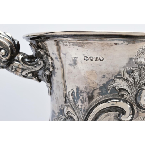 25 - A SILVER TROPHY CUP WITH STAND, the double handled trophy cup of a foliate and scroll detailed desig... 