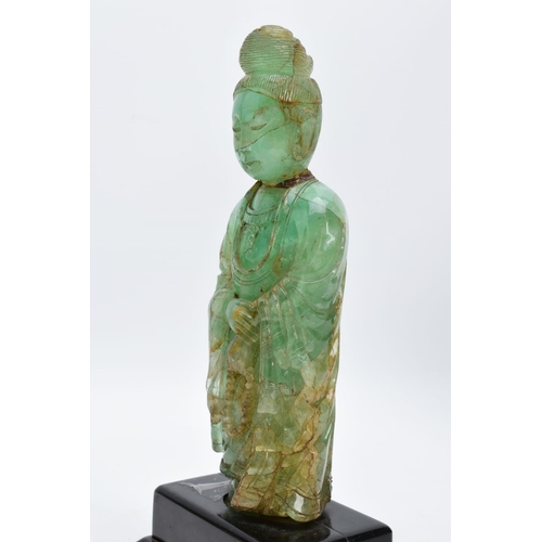 38 - TWO ORIENTAL CARVED FIGURES, believed to be green fluorite, each with a wooden base (one base unatta... 