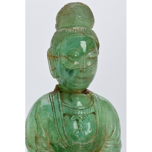 38 - TWO ORIENTAL CARVED FIGURES, believed to be green fluorite, each with a wooden base (one base unatta... 