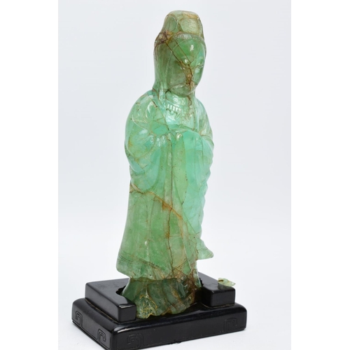 38 - TWO ORIENTAL CARVED FIGURES, believed to be green fluorite, each with a wooden base (one base unatta... 