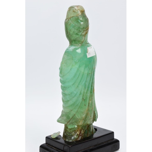 38 - TWO ORIENTAL CARVED FIGURES, believed to be green fluorite, each with a wooden base (one base unatta... 