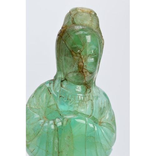 38 - TWO ORIENTAL CARVED FIGURES, believed to be green fluorite, each with a wooden base (one base unatta... 