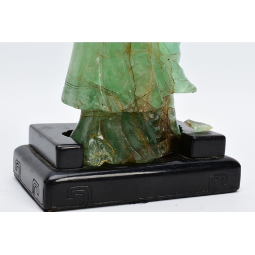 38 - TWO ORIENTAL CARVED FIGURES, believed to be green fluorite, each with a wooden base (one base unatta... 