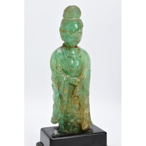 38 - TWO ORIENTAL CARVED FIGURES, believed to be green fluorite, each with a wooden base (one base unatta... 