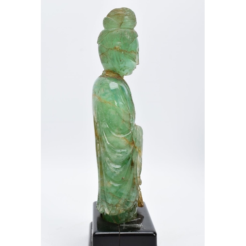 38 - TWO ORIENTAL CARVED FIGURES, believed to be green fluorite, each with a wooden base (one base unatta... 