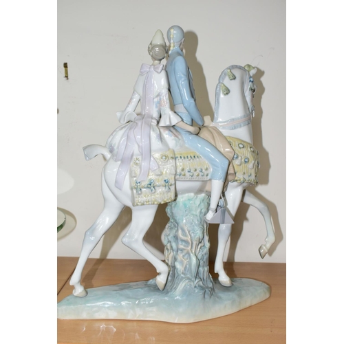 385 - A LLADRO FIGURINE VALENCIANS GROUP No 4648, of a lady and gentleman on horseback, sculptor Fulgencio... 