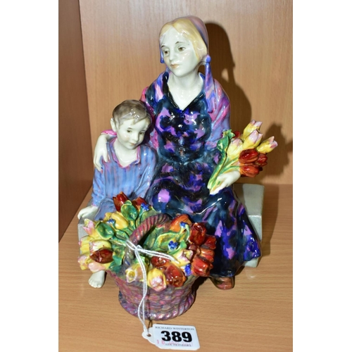 389 - A ROYAL DOULTON FIGURE GROUP 'THE LITTLE MOTHER' HN1399, formerly known as The Young Widow, printed,... 