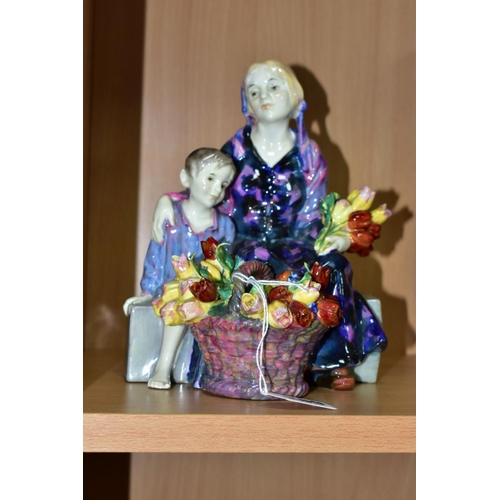 389 - A ROYAL DOULTON FIGURE GROUP 'THE LITTLE MOTHER' HN1399, formerly known as The Young Widow, printed,... 