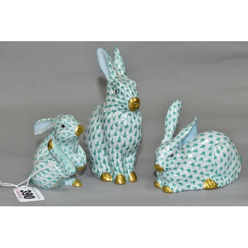 390 - THREE HEREND RABBITS, all with green and white decoration, all modelled in different poses, tallest ... 