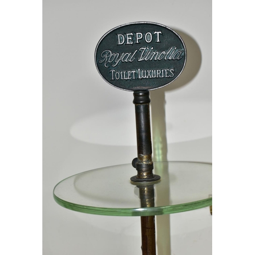 399 - AN EARLY 20TH CENTURY THREE TIER GLASS ADVERTISING DISPLAY STAND, the iron and worn brassed stand wi... 