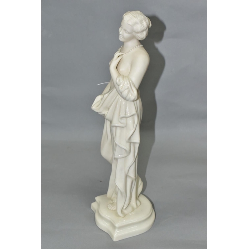 400 - A MID 20TH CENTURY BELLEEK FIGURE OF AFFECTION, a scantily clad lady wearing a string of pearls, mod... 