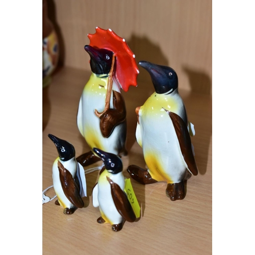 405 - A BESWICK PENGUIN FAMILY, comprising Penguin with Umbrella no 802, Penguin with walking stick no 803... 