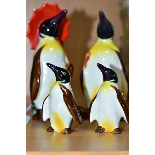 405 - A BESWICK PENGUIN FAMILY, comprising Penguin with Umbrella no 802, Penguin with walking stick no 803... 