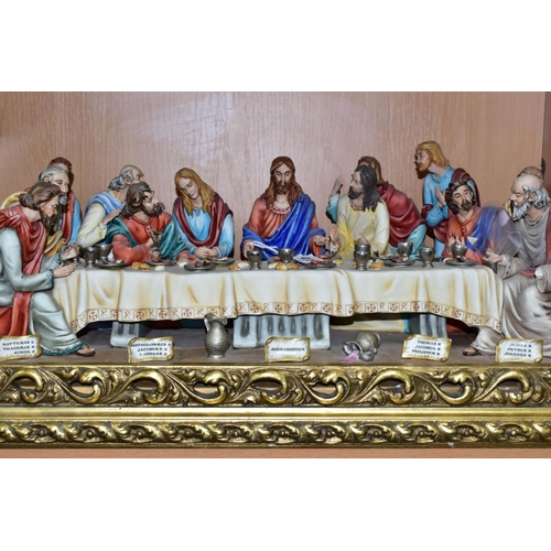 411 - A CAPODIMONTE FIGURE GROUP OF THE LAST SUPPER BY CORTESE, mounted on a giltwood base, marked towards... 