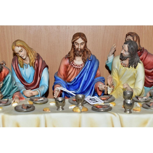 411 - A CAPODIMONTE FIGURE GROUP OF THE LAST SUPPER BY CORTESE, mounted on a giltwood base, marked towards... 