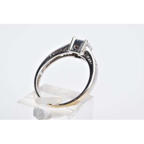 52 - AN 18CT WHITE GOLD DIAMOND RING, designed with a central raised square panel set with nine princess ... 