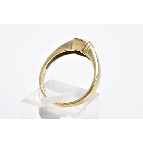 6 - A YELLOW METAL EMERALD RING, the emerald cut within a collet mount to the plain polished band, stamp... 