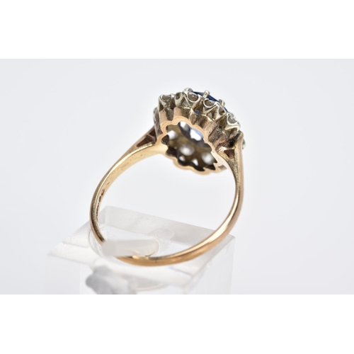 60 - A 9CT GOLD CLUSTER RING, designed with a central oval cut blue sapphire, within a circular cut cubic... 